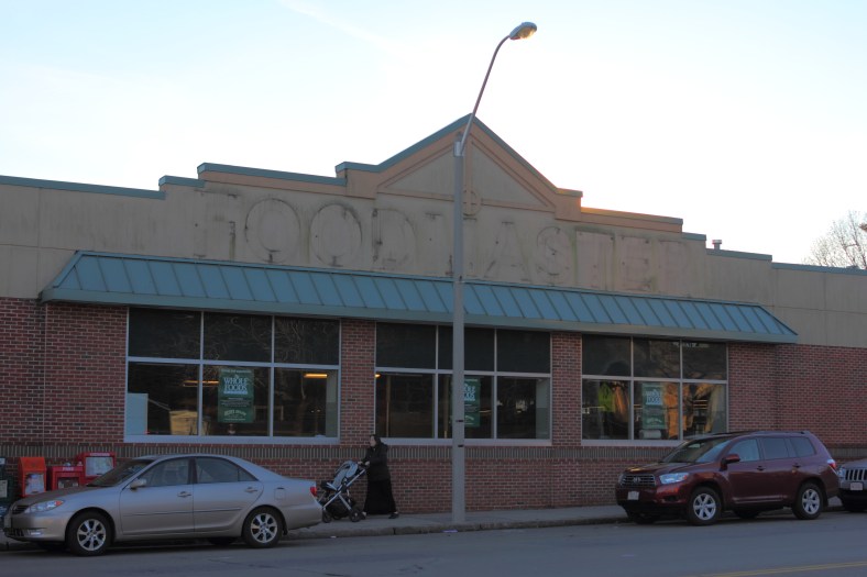 Signs advertising the incoming Whole Foods up in the windows of the former Foodmaster.December 11, 2012.