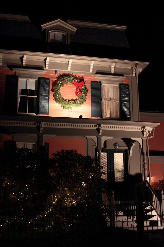 A wreath on an Academy Street home illuminated for the holiday season.December 23, 2012.