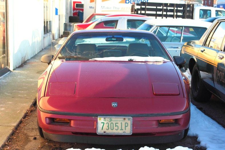 A Pontiac Fiero, driven by Adam Sandler's character in the movie "That's My Boy," sits in the lot of Anderson Automotive showing off a fresh coat of paint, covering the Rush starman logo that adorned the hood in the movie.