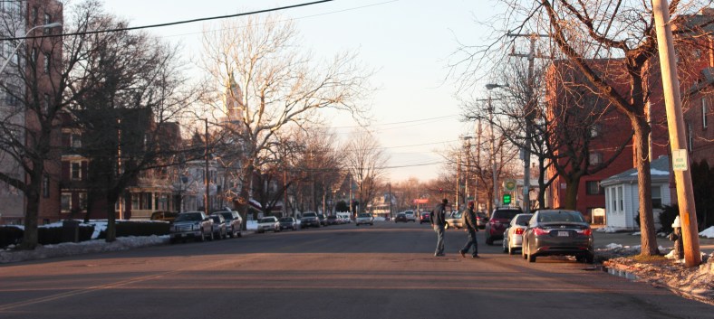 Two men cross Massachusetts Avenue.January 6, 2013.