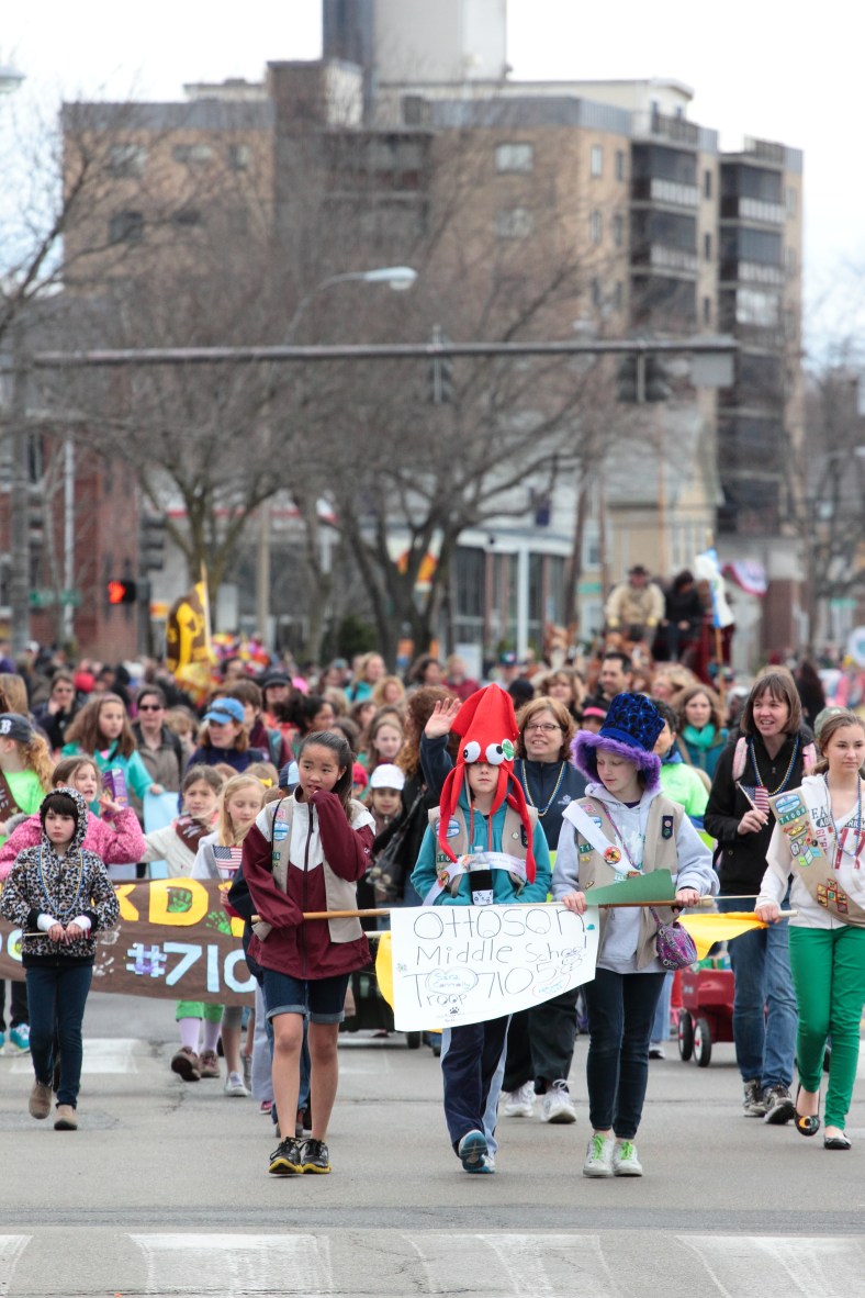 Arlington's girl scouts parade down Massachusetts Avenue during Patriots' Day festivities. April 14, 2013.