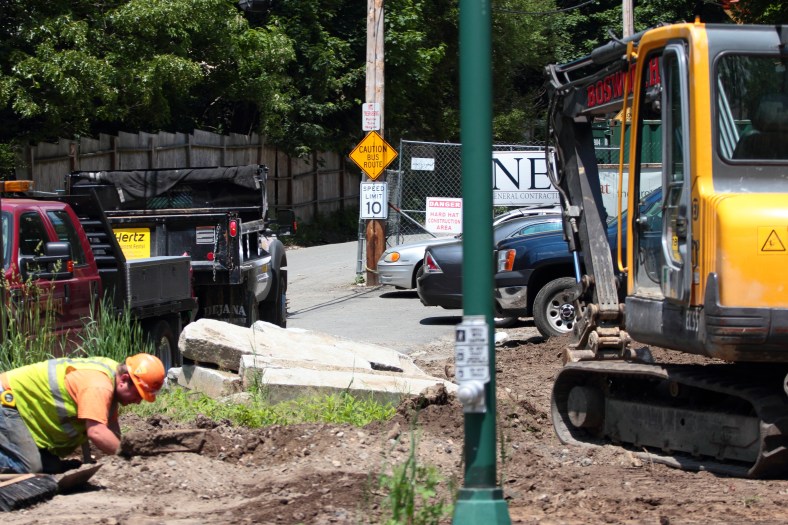 A lone construction worker at the Arlington 360 site along Summer Street. May 31, 2013.