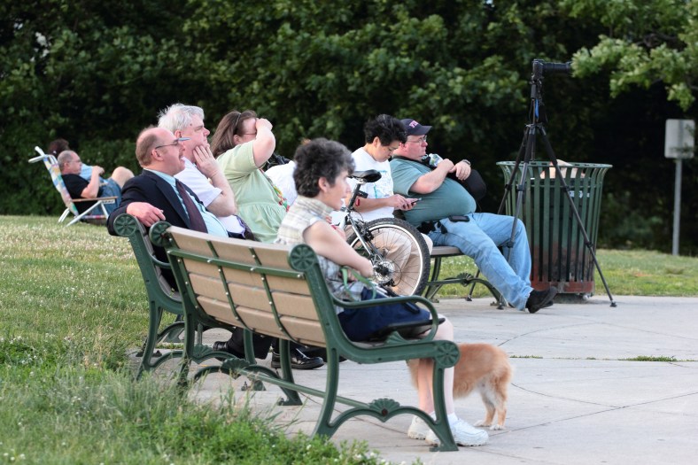 People wait on the benches at Skyline Park for the supermoon to rise. June 23, 2013.