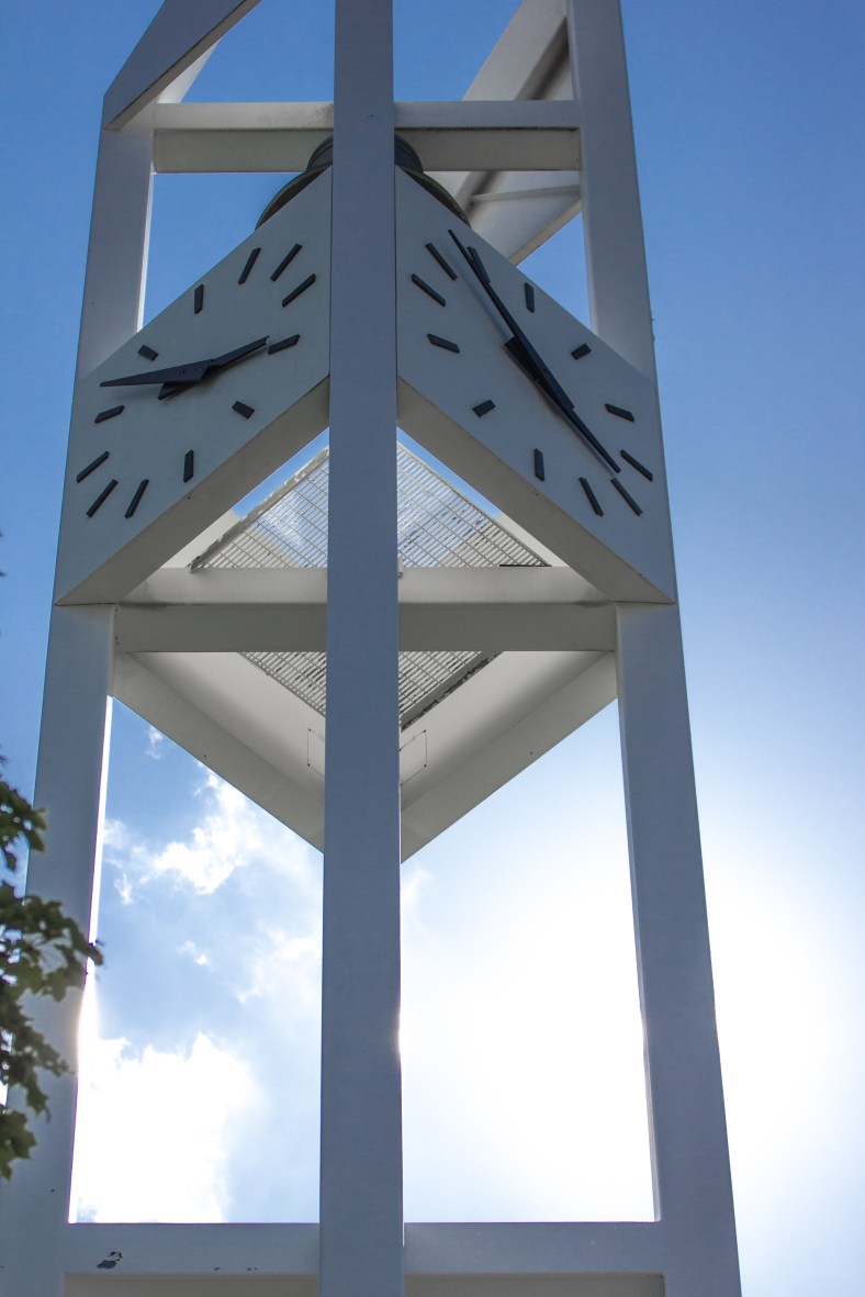 The clock tower of the First Parish Unitarian Universalist Church in Arlington Center blocking the sun on a hot summer day. July 5, 2013.