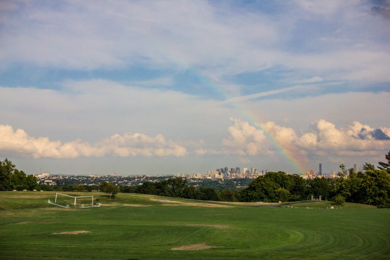 A rainbow appears over Boston as seen from Robbins Farm. July 29, 2013.