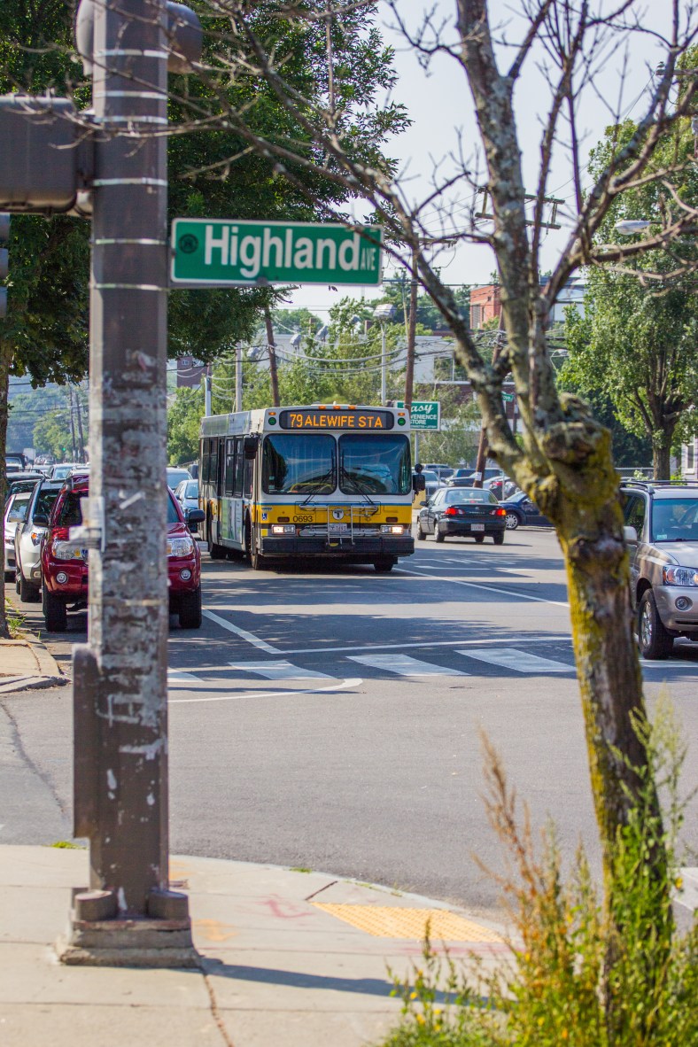 The 79 bus to Alewife Station rumbles down Massachusetts Avenue past Highland Avenue. July 19, 2013.