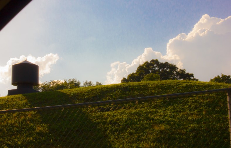 A vent sticks up out of a mound covering an MWRA site on Bellington Street. July 30, 2013.