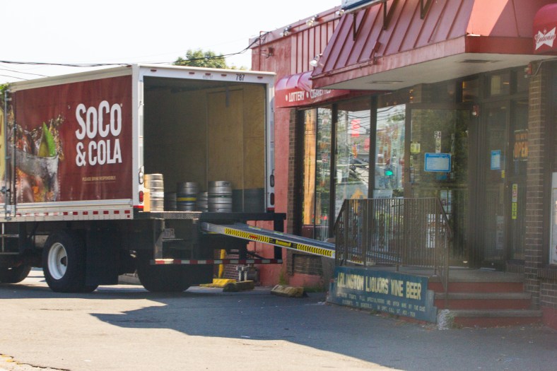 A vendor makes a delivery to a package store on Summer Street. August 28, 2013.