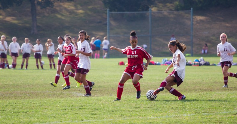The Spy Ponder girls soccer team on the attack against Melrose during a game at Spy Pond field. September 12, 2013.