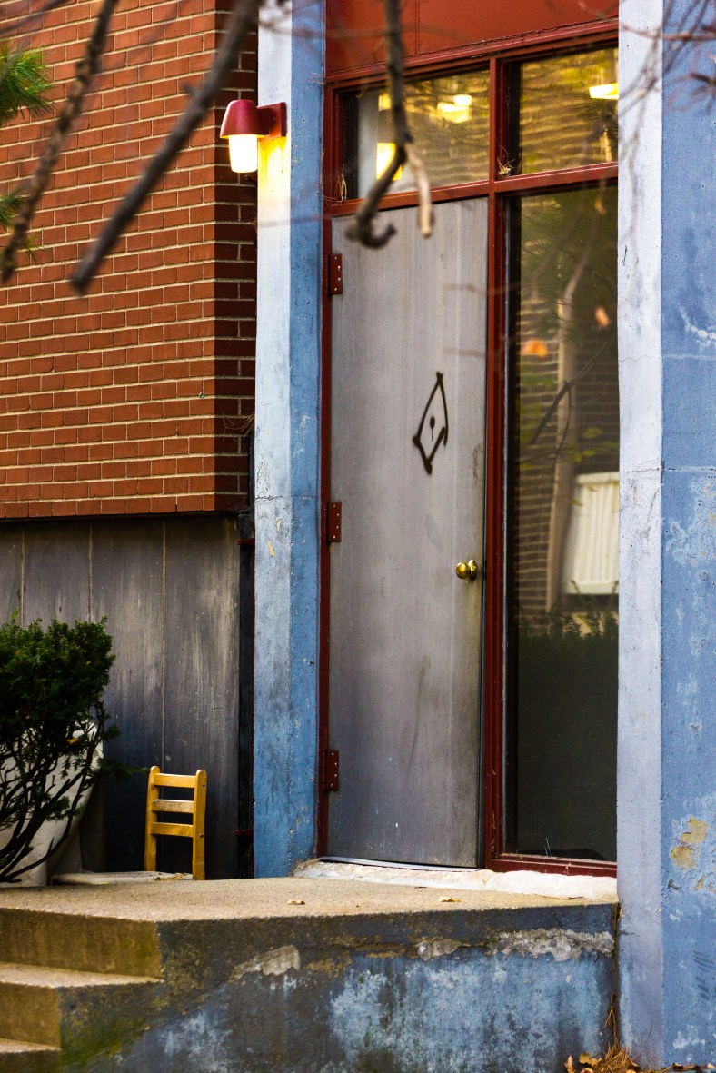 A door on the side of a Massachusetts Avenue apartment building across from the high school. November 15, 2013.