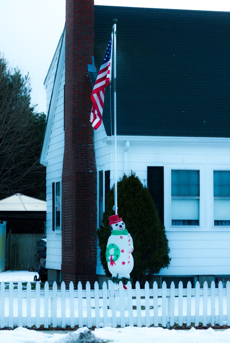 A decorative snowman in the yard of a home along Mystic Valley Parkway. December 24, 2013.