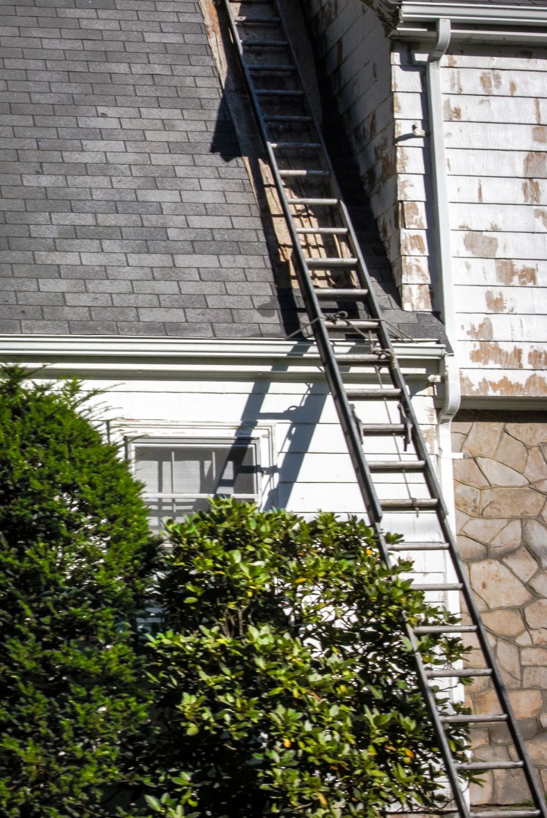 A ladder leans against a Grandview Road home in the midst of a paint job. July 29, 2013.