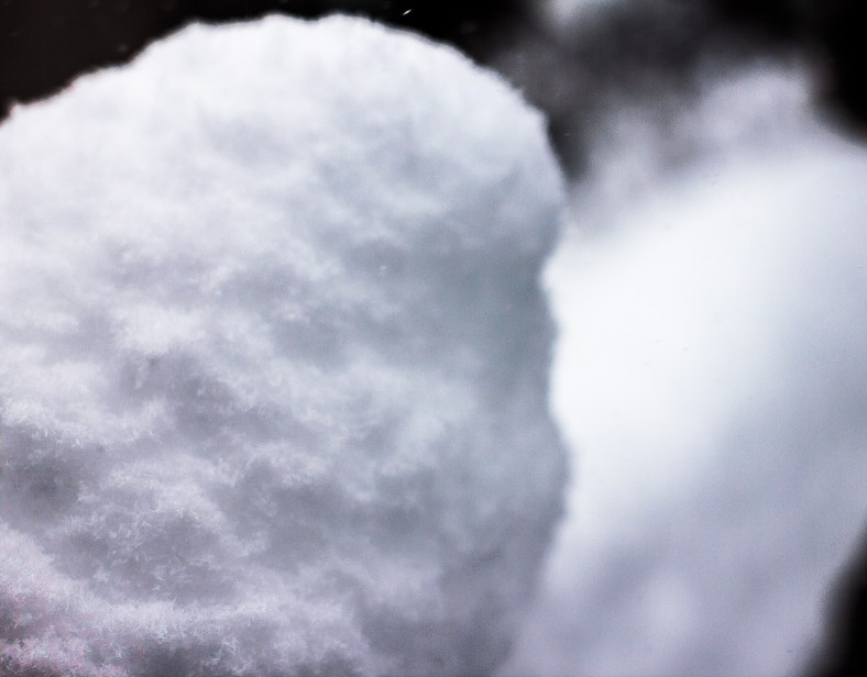 A railing covered with heavy, wet snow during a storm. February 13, 2014.