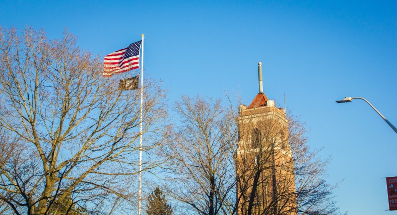 The flags at the Central Fire Station wave strongly in a steady February wind. February 22, 2014. SC