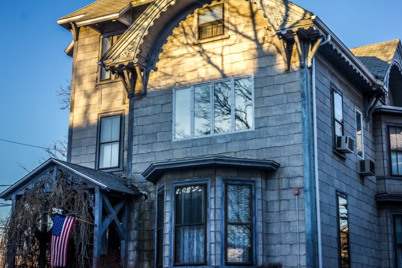 The sun moves up the façade of the house on the corner of Warren and Medford Streets as it sets on a Saturday evening. February 22, 2014. SC