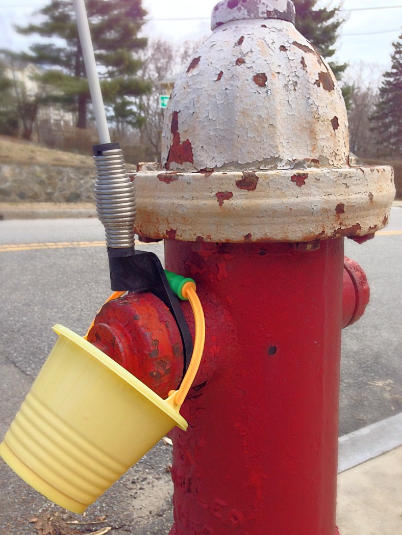 A plastic pail left on a fire hydrant on Hemlock Street. April 4, 2014.