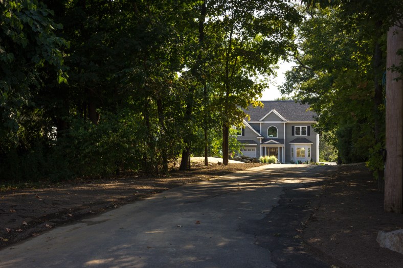 A newly contracted home at the end of a long, shady driveway off of Millett Street. September 11, 2013.