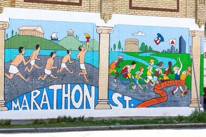 A newly created mural on the Marthon Street facing wall of Anthony's East Side Deli shows the transition of the marathon from ancient Greece to Boston. June 20, 2014.