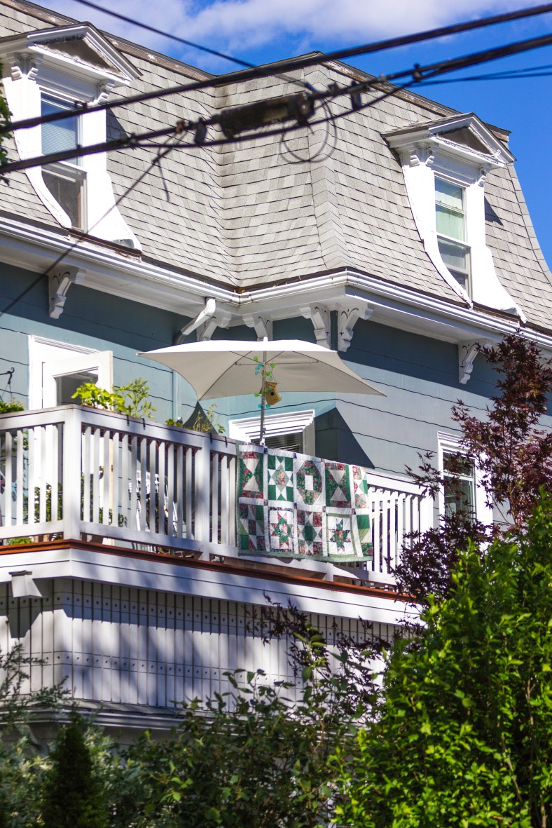 An airy second story porch on a Teel Street home. June 20, 2014.