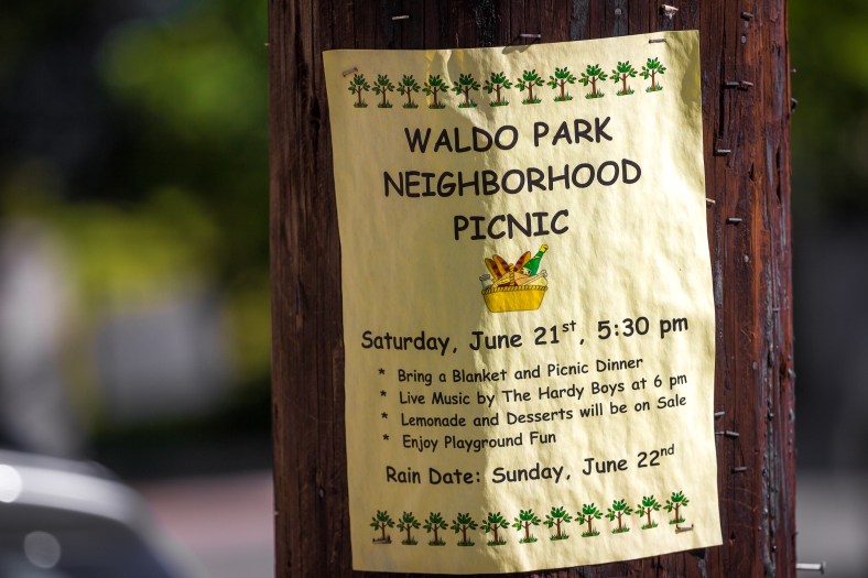 A flyer posted near Waldo Park in East Arlington informing the community about a first day of summer neighborhood picnic. June 20, 2014.