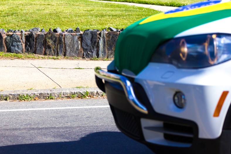 In celebration of the World Cup, a driver put a hood cover of the host nation Brazil's flag on their car—a sight very nearly captured by this photographer on Medford Street. June 20, 2014.