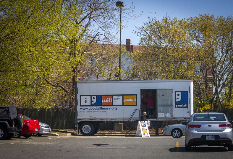 A man makes a donation to the Goodwill truck in the parking lot of Stop & Shop. April 26, 2013