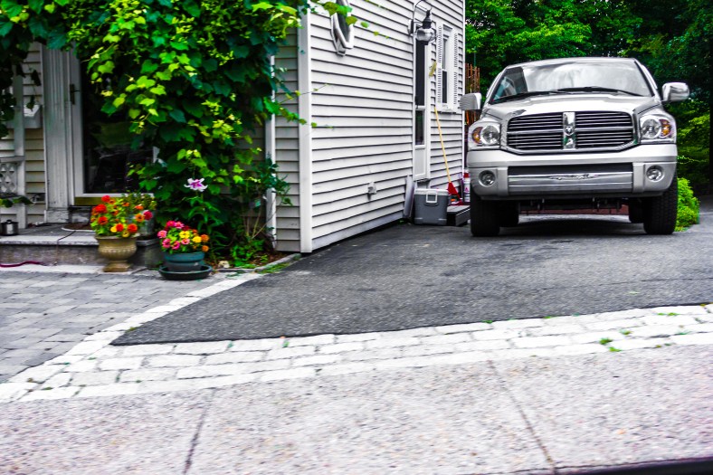 A pickup truck in the driveway of a Hemlock Street home. August 1, 2014.