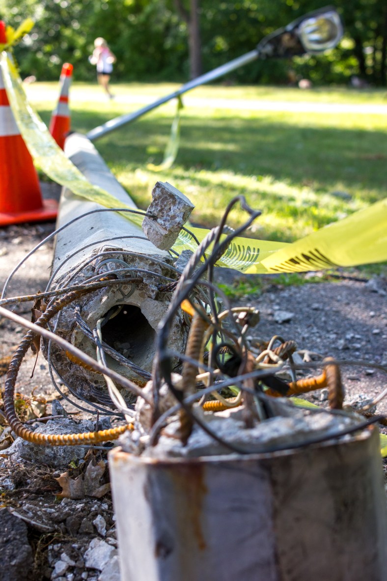A streetlight along Mystic Valley Parkway lies in a tangled mess on the ground, as it has for a few weeks now. August 8, 2014.