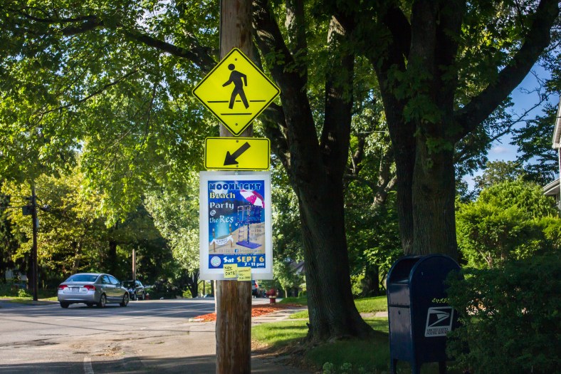 A sign along Park Avenue advertising the Moonlight Beach Party at the Arlington Reservoir. August 8, 2014.