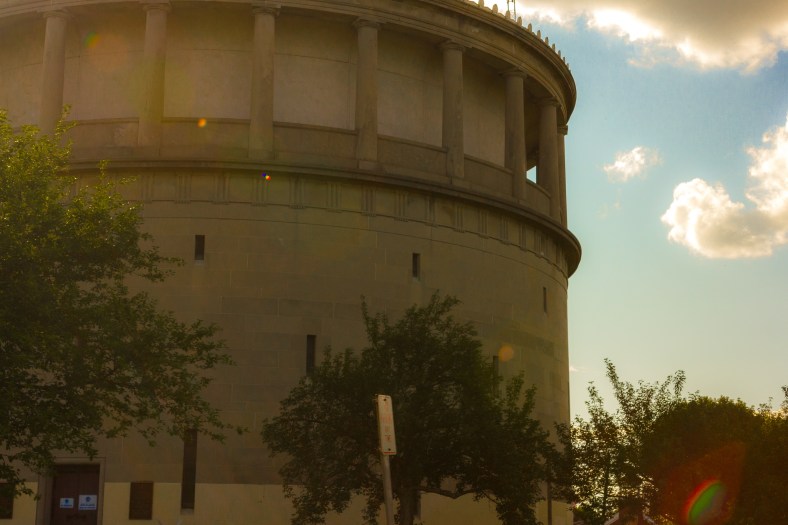 The sun shines bright over the top of the Park Ave water tower. August 8, 2014.