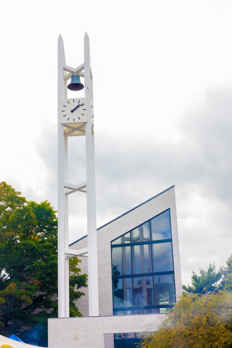 Smoke rises from Town Day food stalls along Massachusetts Avenue in front of the distinctive architecture of the Unitarian Universalist Church. September 13, 2014.