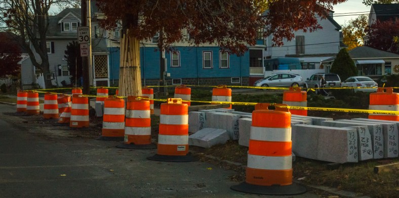 Orange barrels surround a supply of curbstones awaiting placement as part of the Mass Ave project in East Arlington. November 10, 2014.