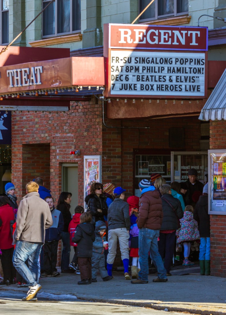 Parents and children wait to be let in to a sing-a-long screening of Mary Poppins at the Regent Theatre. November 29, 2014.