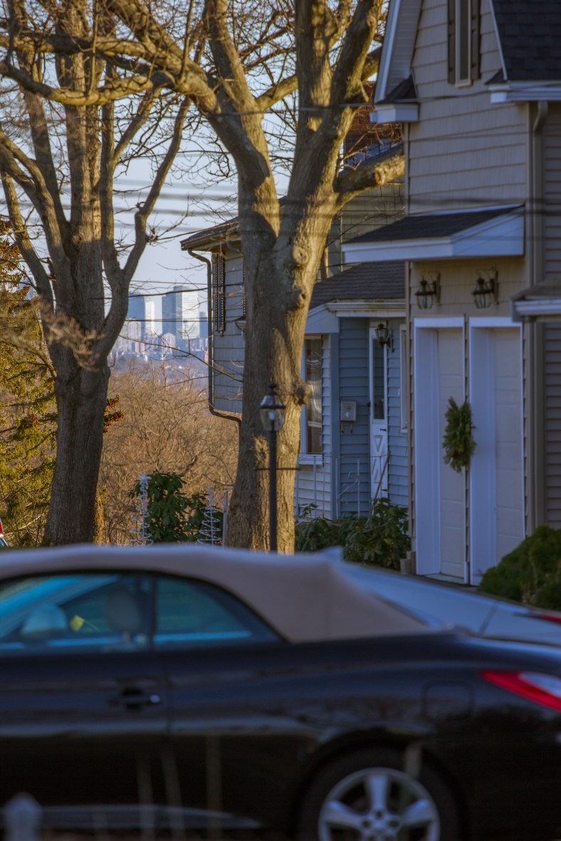 The buildings of Boston can be seen in the distance in this view down Epping Street. December 26, 2014.