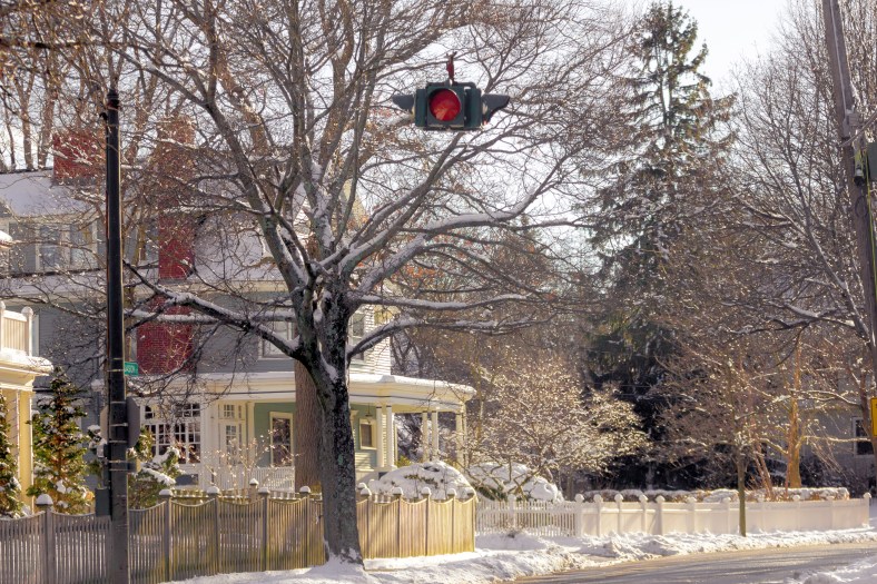 A light signaling a four way stop hangs over the intersection of Jason Street and Gray Street. January 25, 2015.