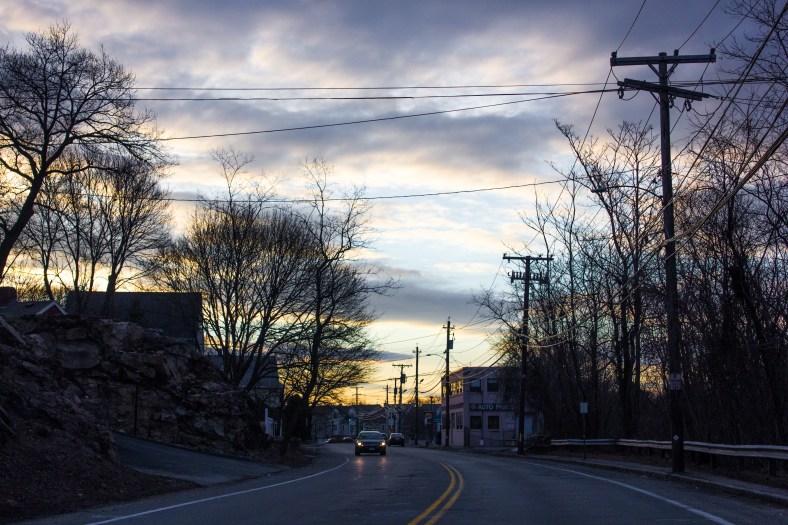 The sun starts to light up the sky over Summer Street in the early morning. March 21, 2014.
