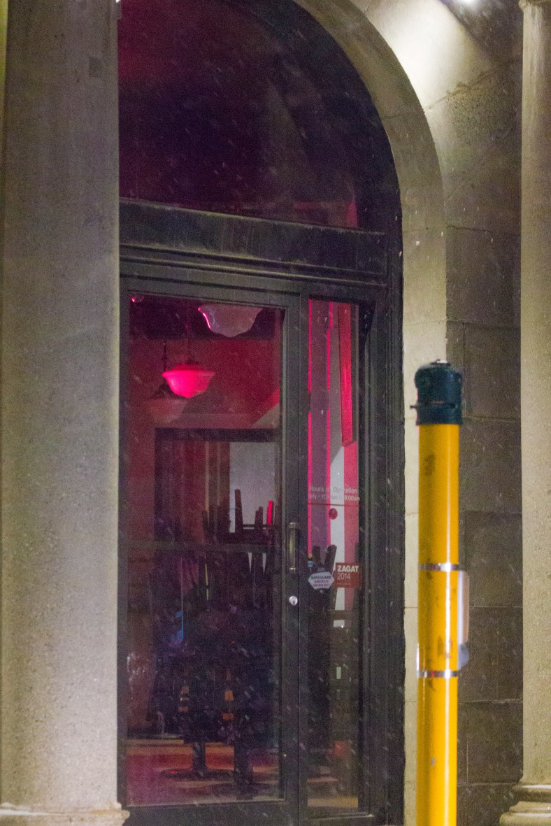 The glow of an illuminated sign inside a Capitol Square restaurant. March 01, 2015.