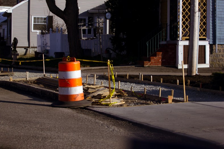 Stakes mark off a section of what is to be a new sidewalk along Massachusetts Avenue. May 02, 2015.