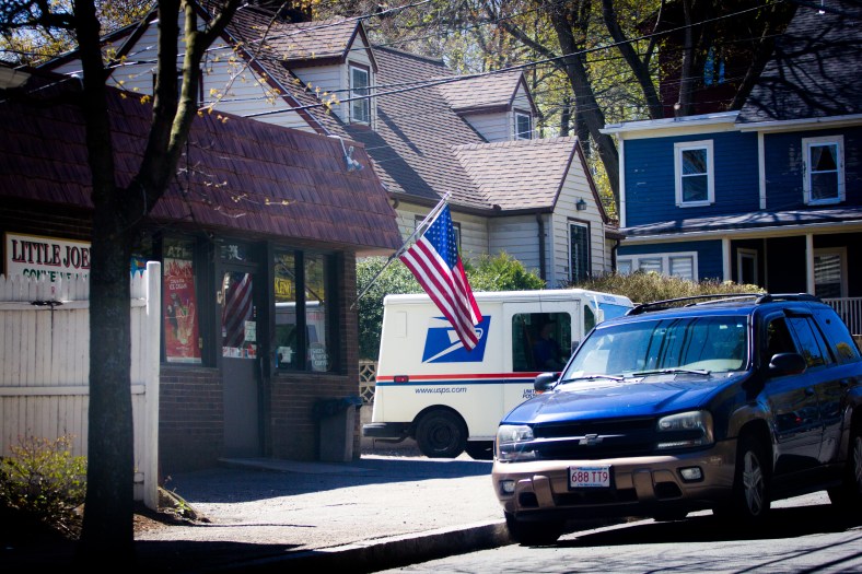 A mail truck pulls out of Summer Street Place next to Little Joe's convenience store. May 02, 2015. SC