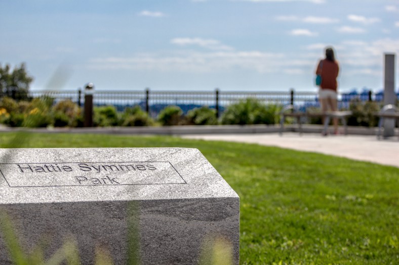 A woman enjoys the view of the Boston skyline and surrounding towns from Hattie Symmes Park. August 29, 2015.