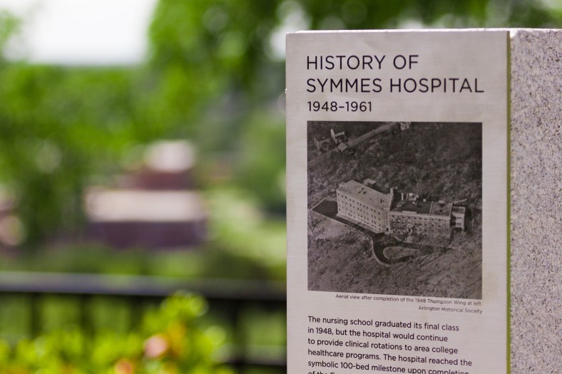 One of a few stone posts  in Hattie Symmes Park with (very sharp) metal plates affixed that chronicle the history of the Symmes site. August 29, 2015.