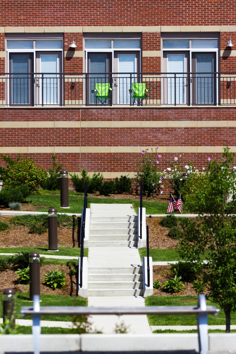 Two chairs facing a sweeping view of Arlington, Boston, and other points South and East at Arlington 360. August 29, 2015.