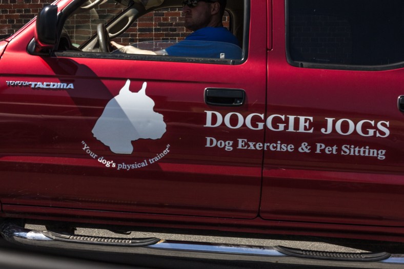 The truck of a canine-centric business driving up Highland Avenue. April 26, 2013.